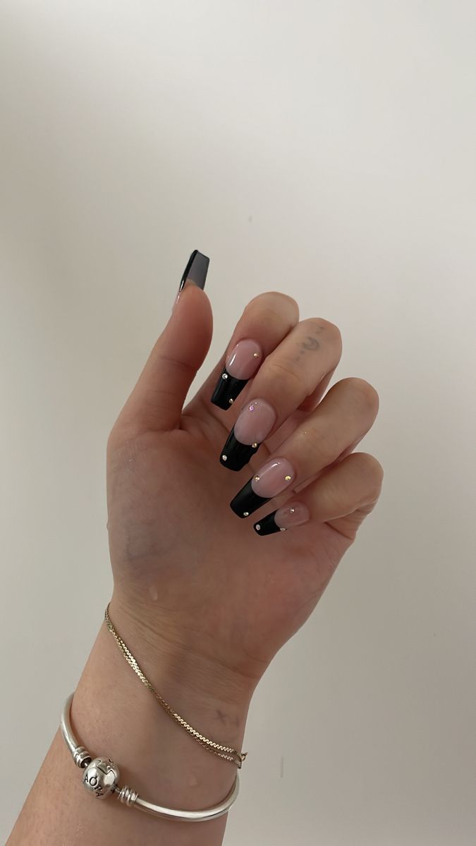 Elegant Edgy French Manicure: Nude Base with Bold Black Tips and Rhinestone Accents