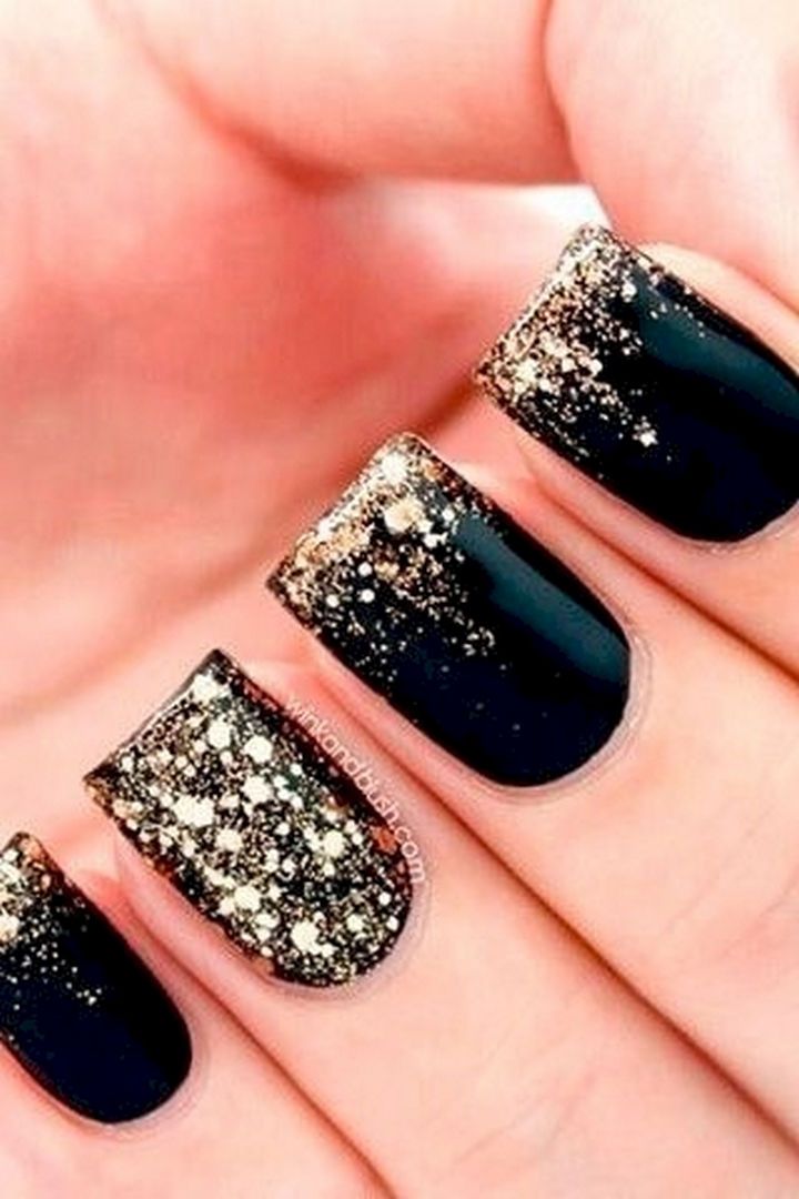 Glamorous Black and Gold Ombre Nail Design for Sophisticated Occasions.