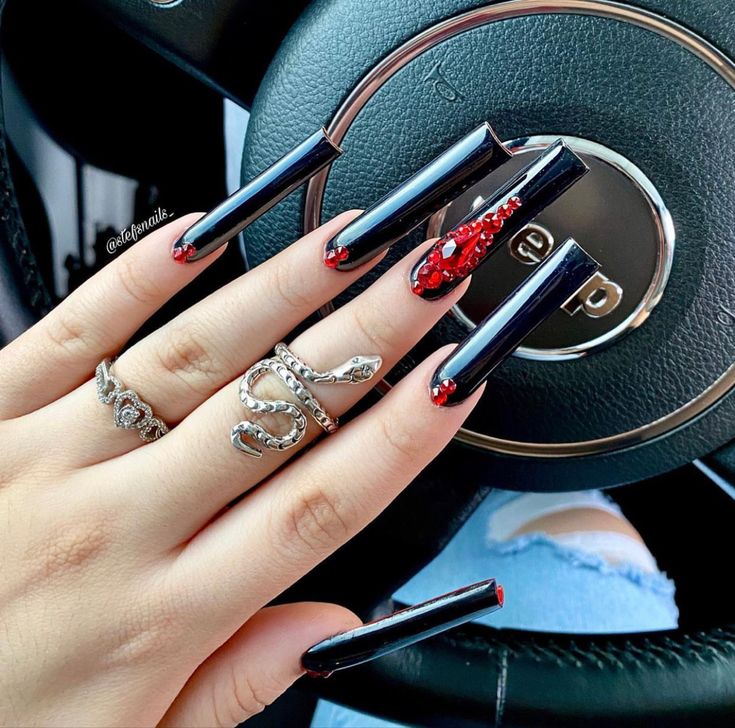 Chic Long Black Nails with Glossy Finish and Bold Red Rhinestone Accent