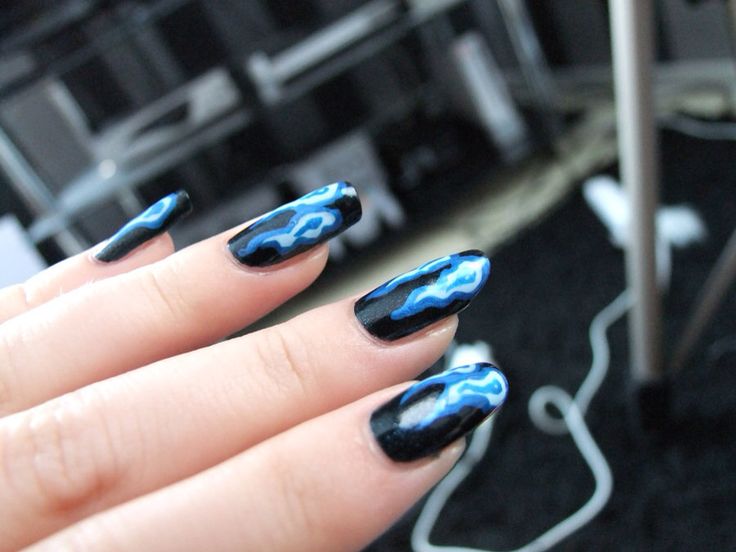 Bold Black and Blue Lightning Nail Design: A Striking Fusion of Elegance and Edginess.