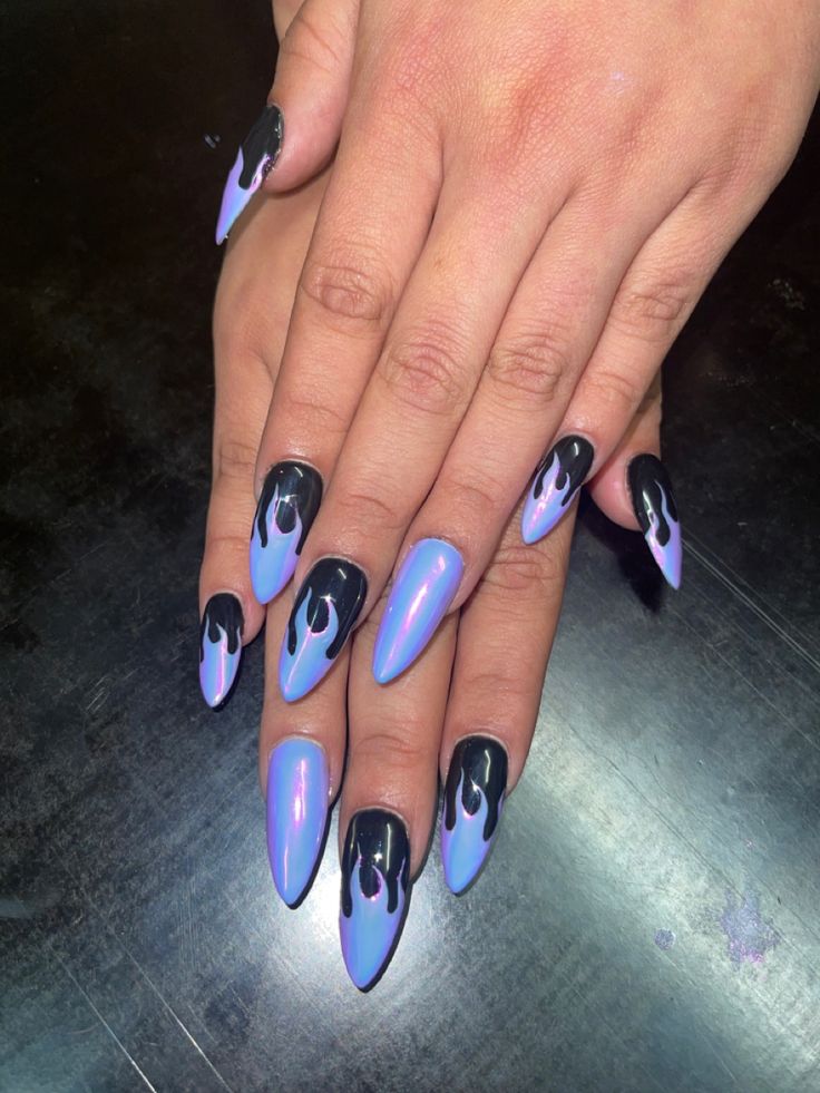 Dramatic Stiletto Nail Design: Mesmerizing Lavender-Black Dripping Effect.