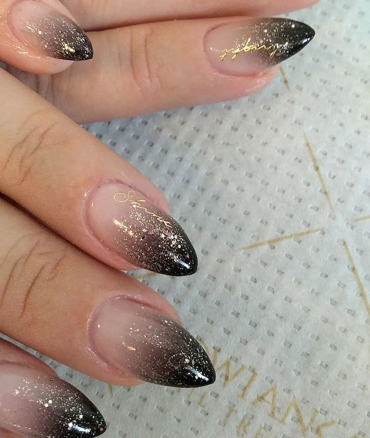 Chic Gradient Ombre Nails with Sparkling Glitter and Elegant Gold Accents.