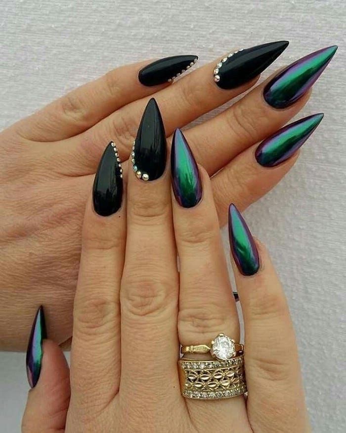 Glamorous Black and Iridescent Nail Design with Sparkling Rhinestones.