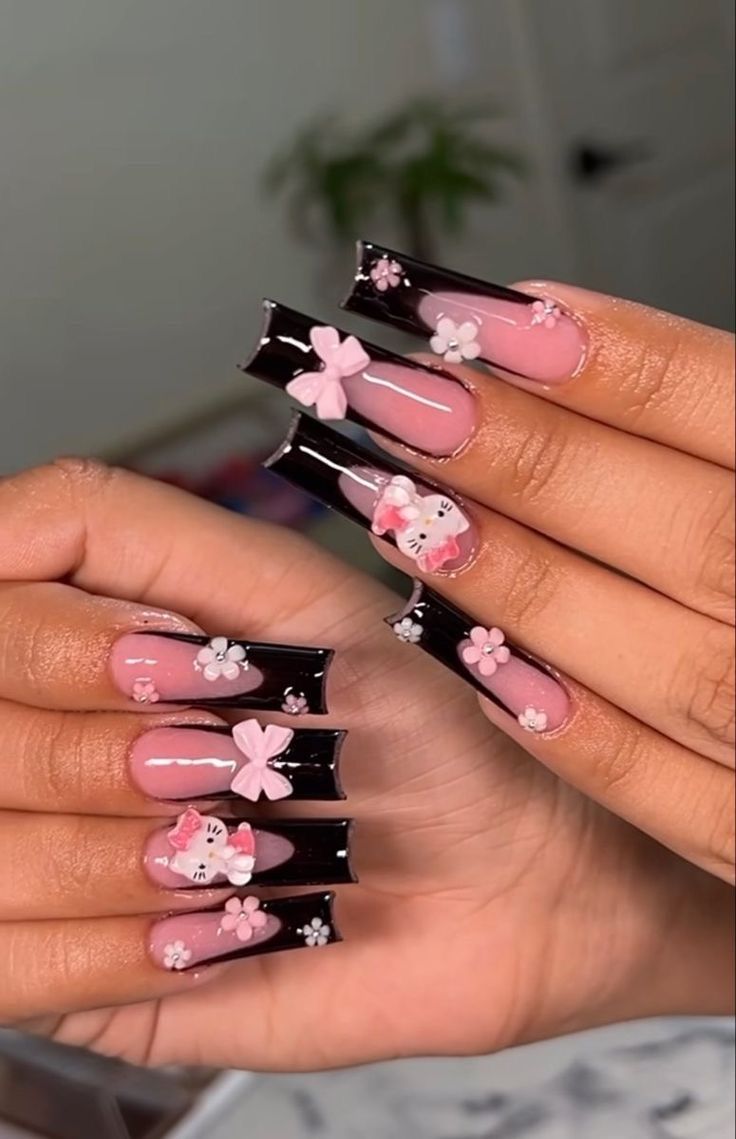 Whimsical Floral Nail Design with Pink Base, White Flowers, and Black Tips