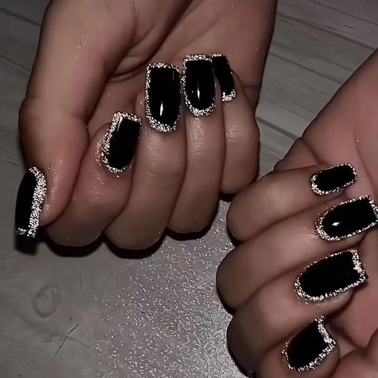 Sophisticated Black and Silver Nail Art for Glamorous Occasions.