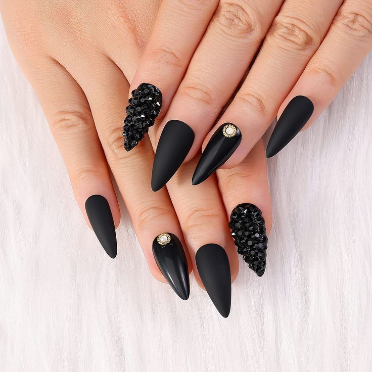 Chic Black Matte Nails with Elegant Textures and Rhinestone Accents.