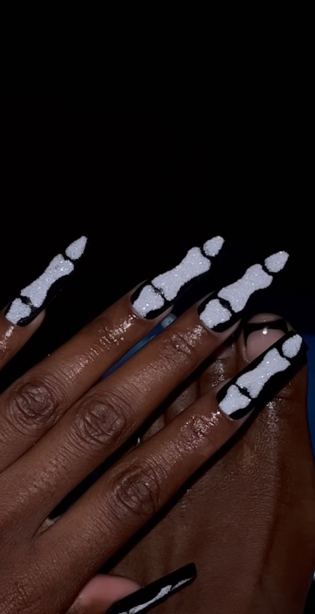 Playful Black and White Bone Pattern Nail Design for a Bold Statement.