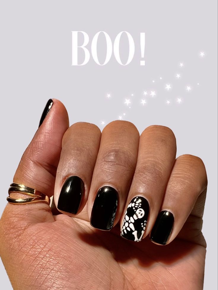 Elegant Halloween Manicure: Glossy Black Nails with Skeleton and Spider Web Designs