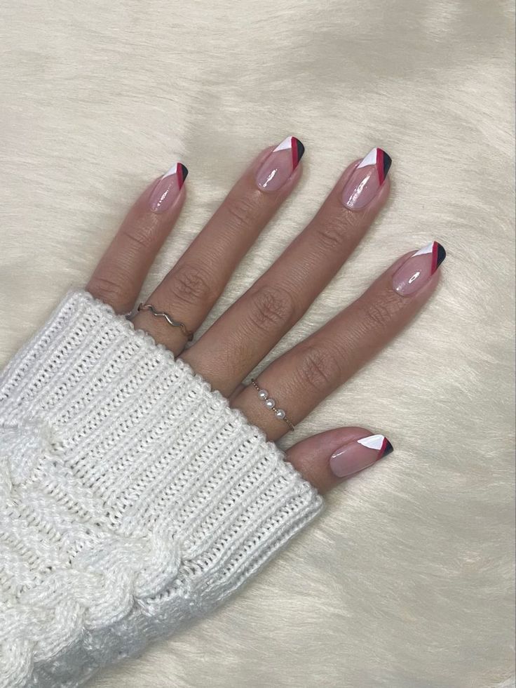 Bold Geometric Nail Design with Triangular Accents and Elegant Rings.