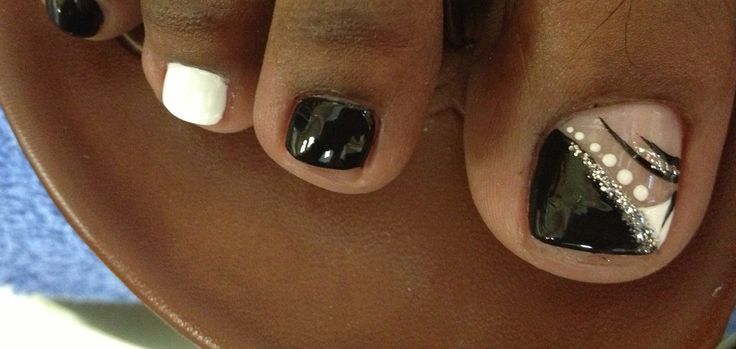 Elegant Geometric Pedicure with Black, White, and Nude Shades.