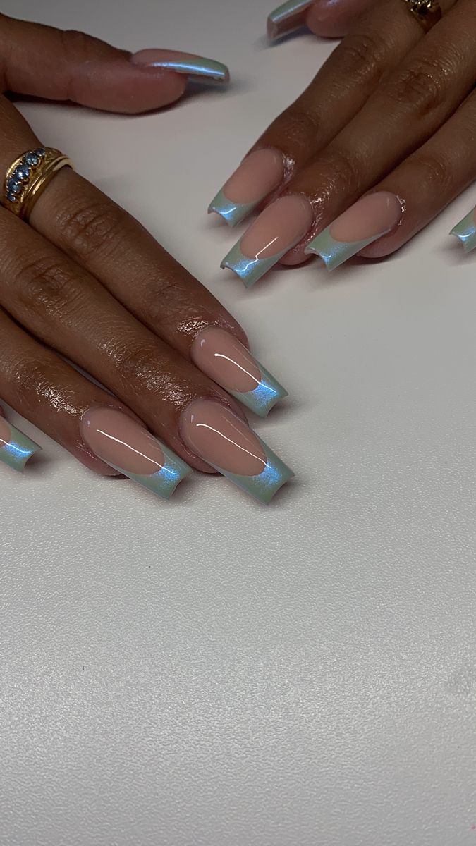 Modern French Nail Design: Elegant Nude and Iridescent Blue Combination.