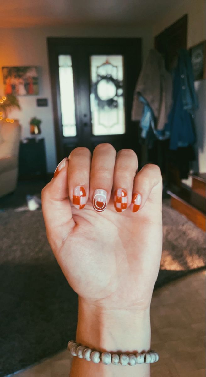 Trendy Red and White Striped Nail Design with Artistic Half-Moon Accents.