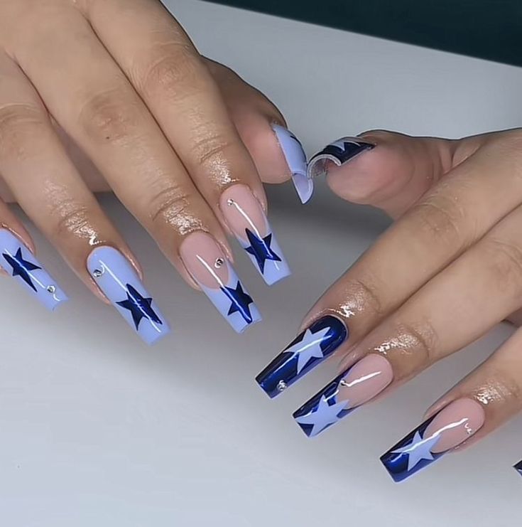 Chic Star-Themed Nail Design with Light Blue and Navy Hues