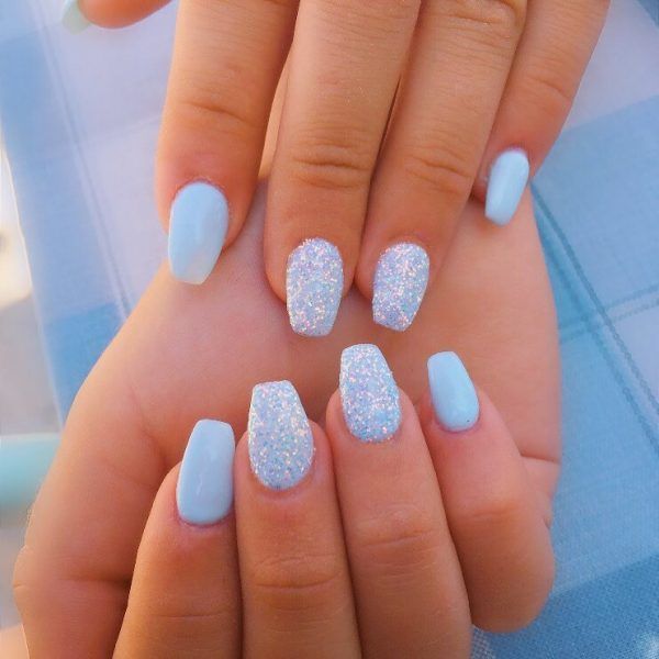 Playful Pastel Blue Nail Design with Matte and Glitter Accents for a Vibrant Aesthetic.