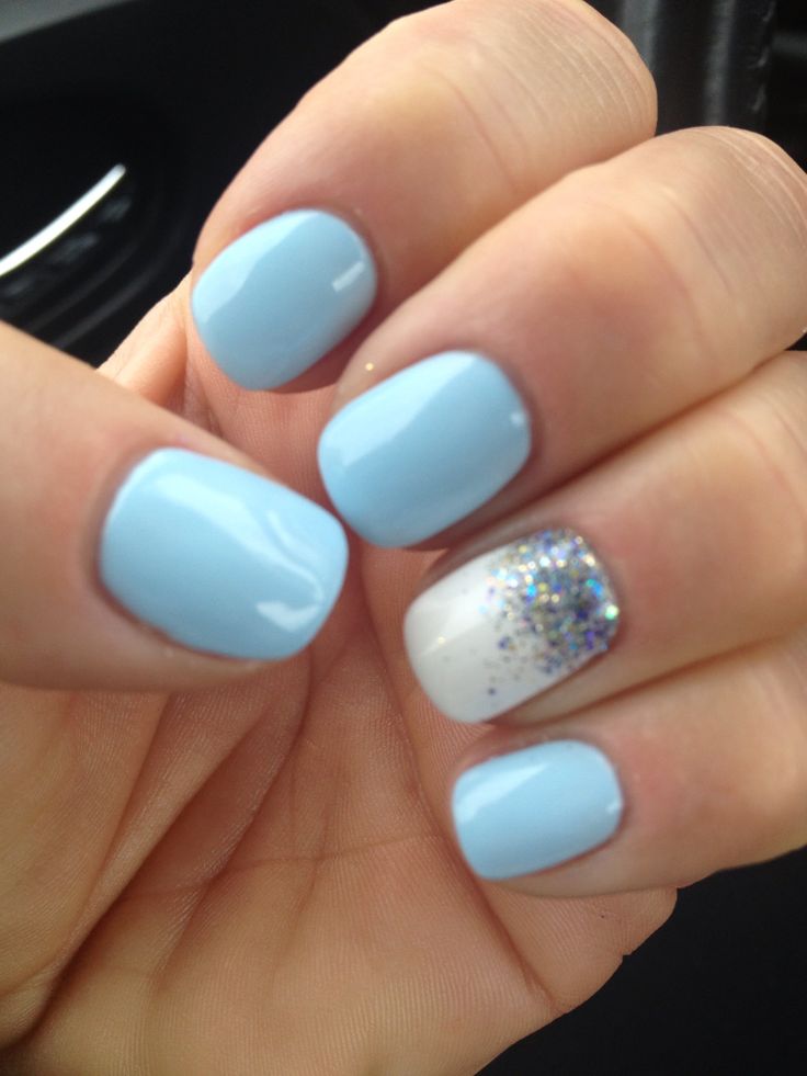 Elegant Soft Blue Manicure with Glamorous Glitter Accents