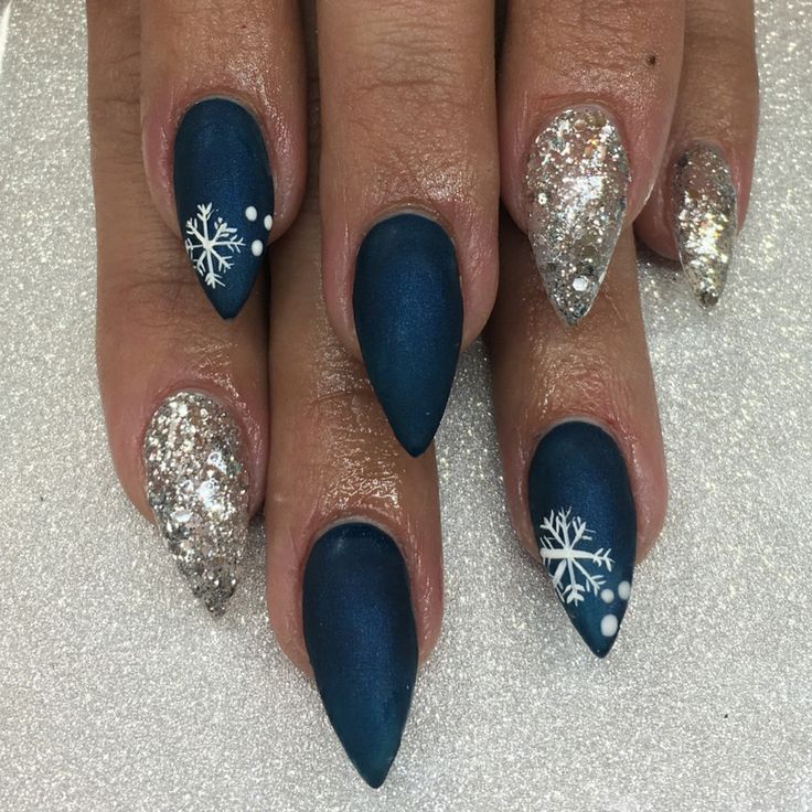 Elegant Winter Nail Design with Navy Matte Finish, Glitter Accents, and Snowflake Details.