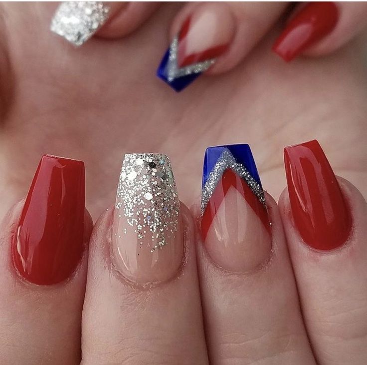 Bold Red and Sparkling Silver Manicure with Playful Geometric Blue Accents.