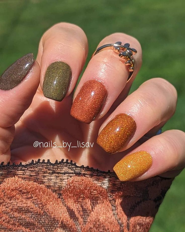 Charming Autumn Nail Design with Bold Earthy Tones and Elegant Textured Finish.