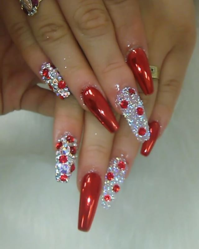 Glamorous Red and Silver Nail Design: Elegant, Festive Glamour with Glossy Red and Glittering Accents.