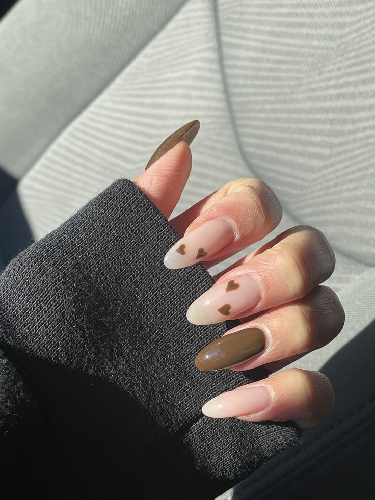 Chic Almond-Shaped Nails: Trendy Color Palette with Romantic Heart Designs