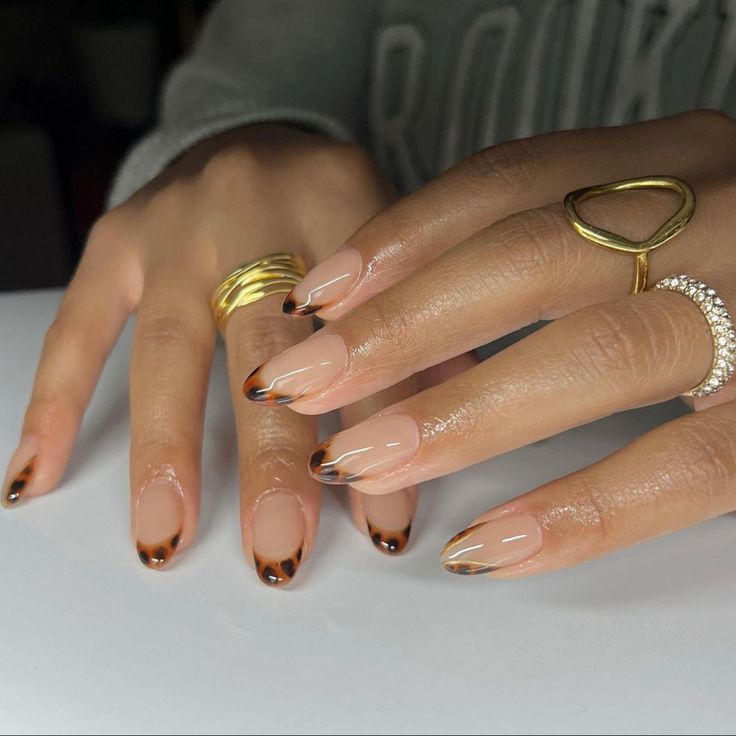 Elegant Nude and Deep Brown Nail Design with Glossy Finish