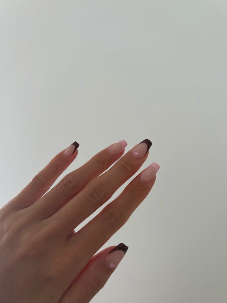 Chic Nail Design: Soft Pink and Dark Brown Tips with Delicate Accents