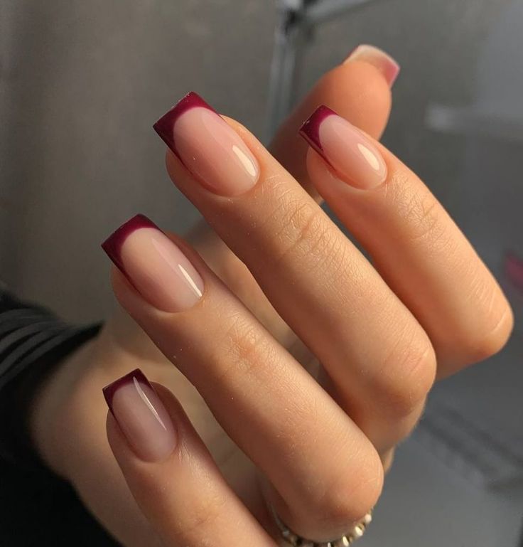 Chic Nail Art: Elegant Blend of Nude and Deep Burgundy with Stylish French Tips.