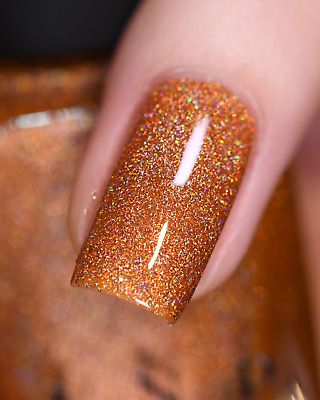 Vibrant Shimmering Orange Nail Design with Holographic Glitter for Glamorous All-Season Sparkle.