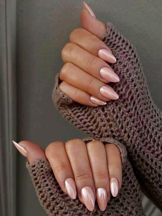 Chic Soft Pink Nail Design with Pointed Shape and Cozy Knit Gloves.