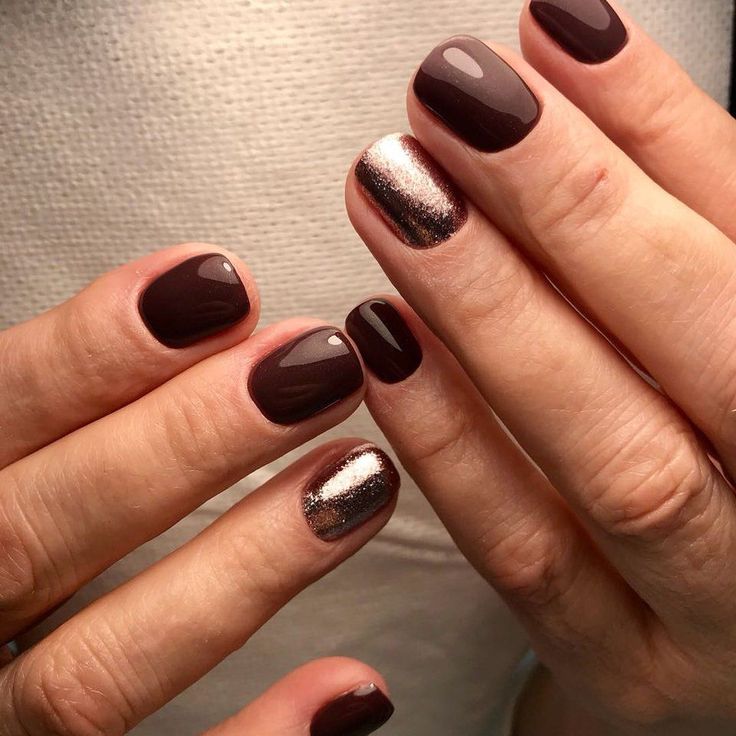 Chic Deep Brown Shimmer Nail Design: A Sophisticated Blend of Solid and Glitter Accents.