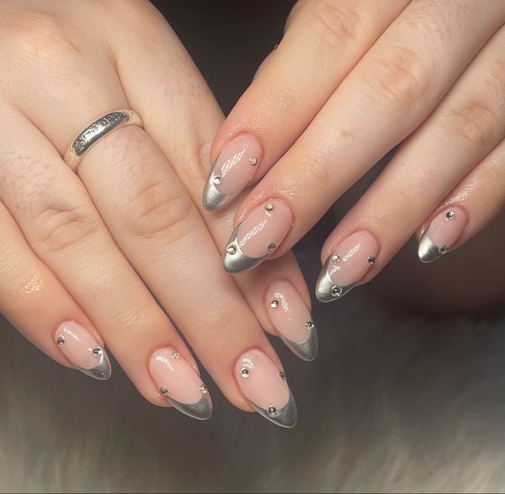 Chic Nude Nails with Silver Tips and Gemstone Accents for a Modern Sophistication.