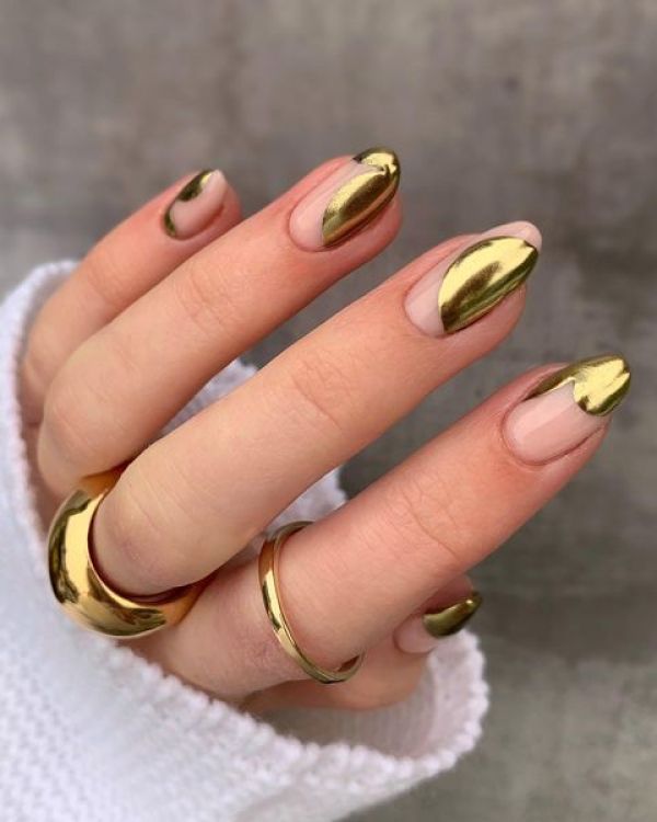 Chic Metallic Gold-Tipped Almond Nails: A Sophisticated Look with Bold Accessories.