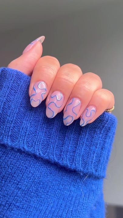 Modern Artistic Nail Design with Fluid Patterns and Playful Pastel Colors