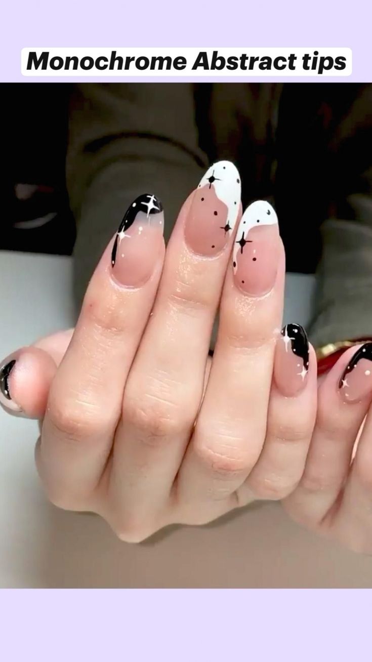 Chic Monochrome Abstract Nail Design with Soft Nude and Bold Black & White Patterns