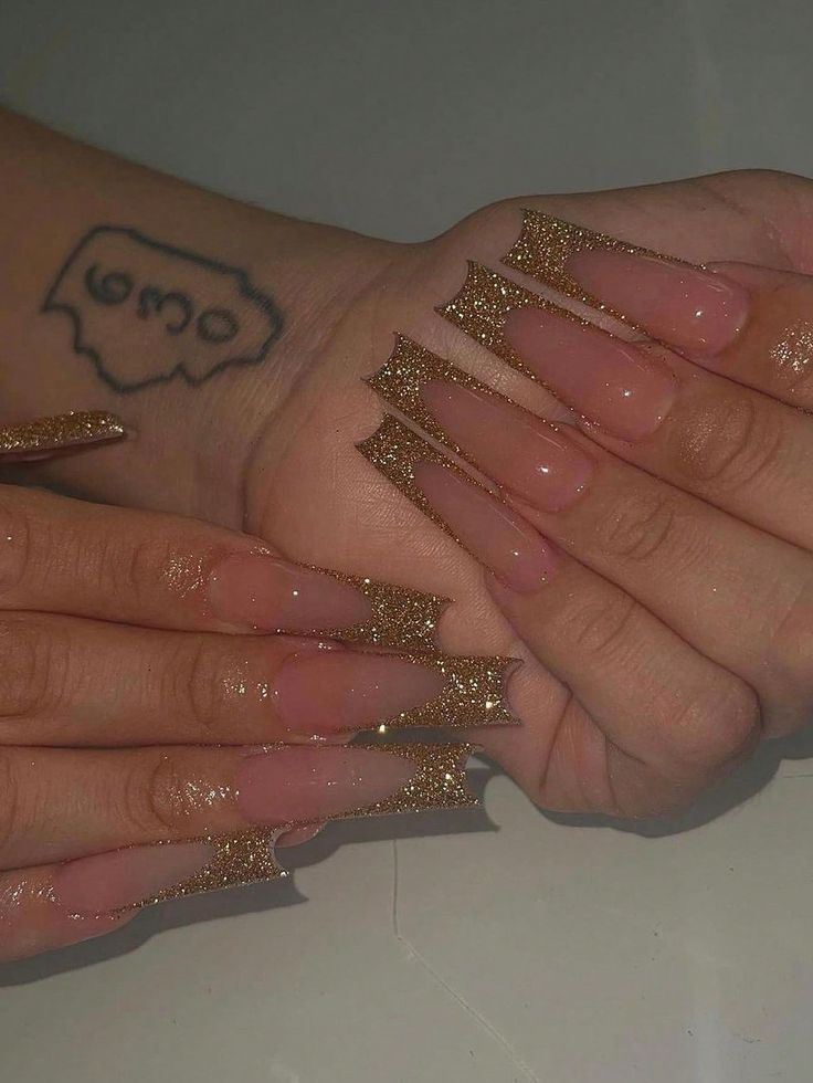 Chic Long Tapered Nail Design with Nude and Glittering Gold Accents