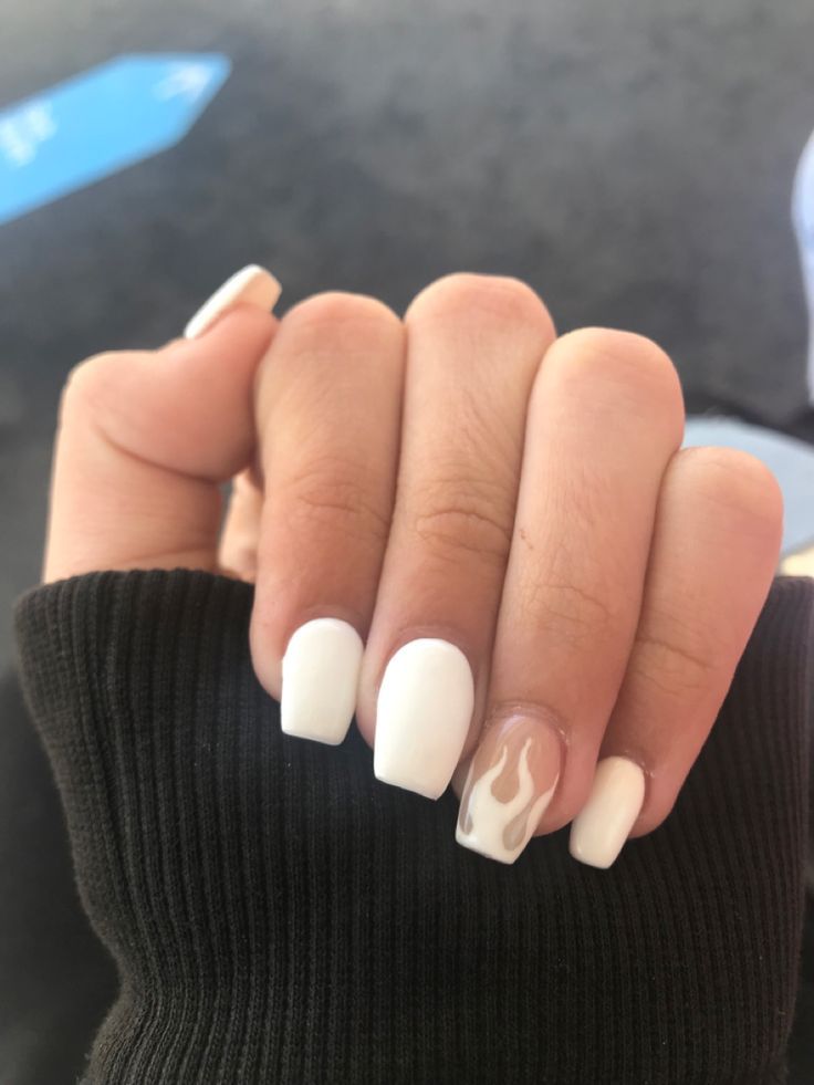 Chic White Nail Design with Trendy Flame Accent for a Stylish Statement.