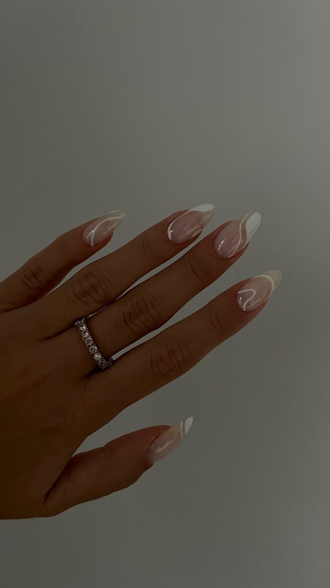 Sophisticated Almond-Shaped Nail Design with Translucent Pink and White Swirls in a Modern French Style.