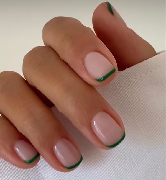 Chic Nude Base with Vibrant Green French Tips: A Versatile Manicure for Any Occasion