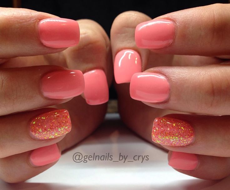 Charming Coral Nail Design: Glossy Finish with Playful Glitter for a Fresh Summer Look.