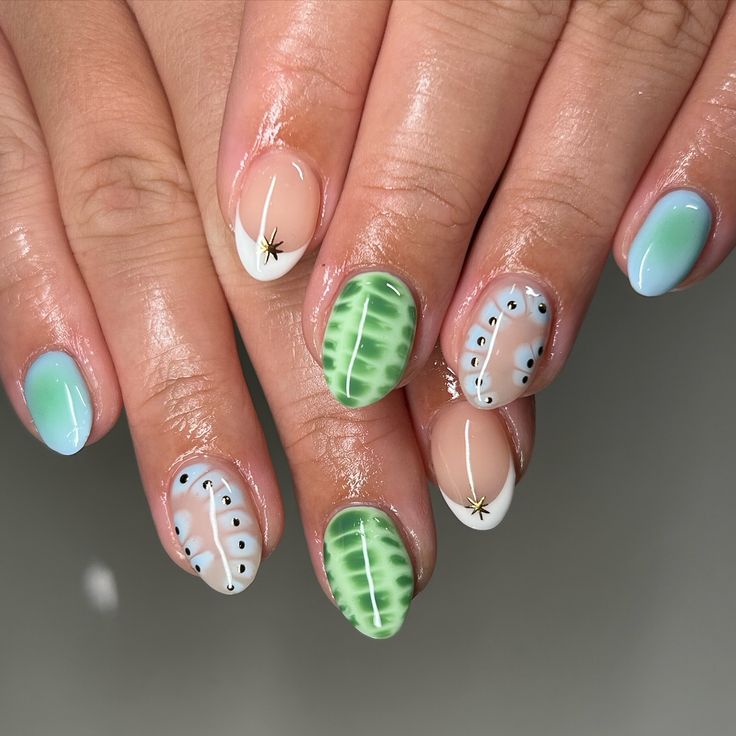 Vibrant Tropical Nail Design with Unique Patterns and Glossy Finishes for a Playful Summer Look.