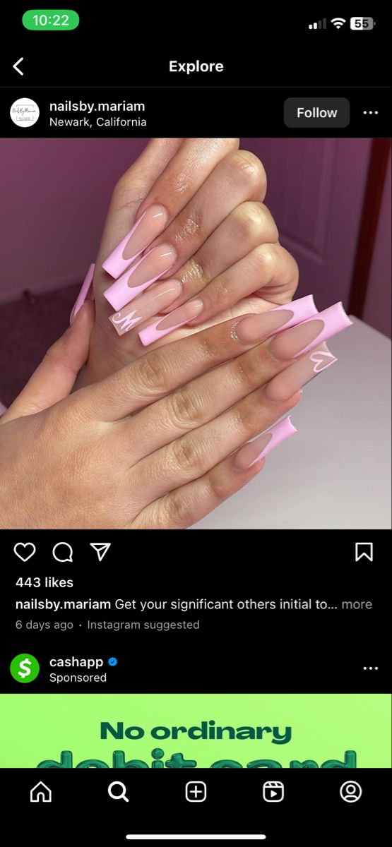 Chic Pink Nail Design with Long Tapered Tips and Playful White Accents