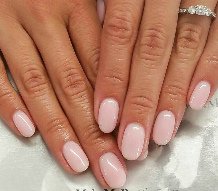 Chic and Sophisticated Soft Pink Oval Nails Enhance Natural Beauty.