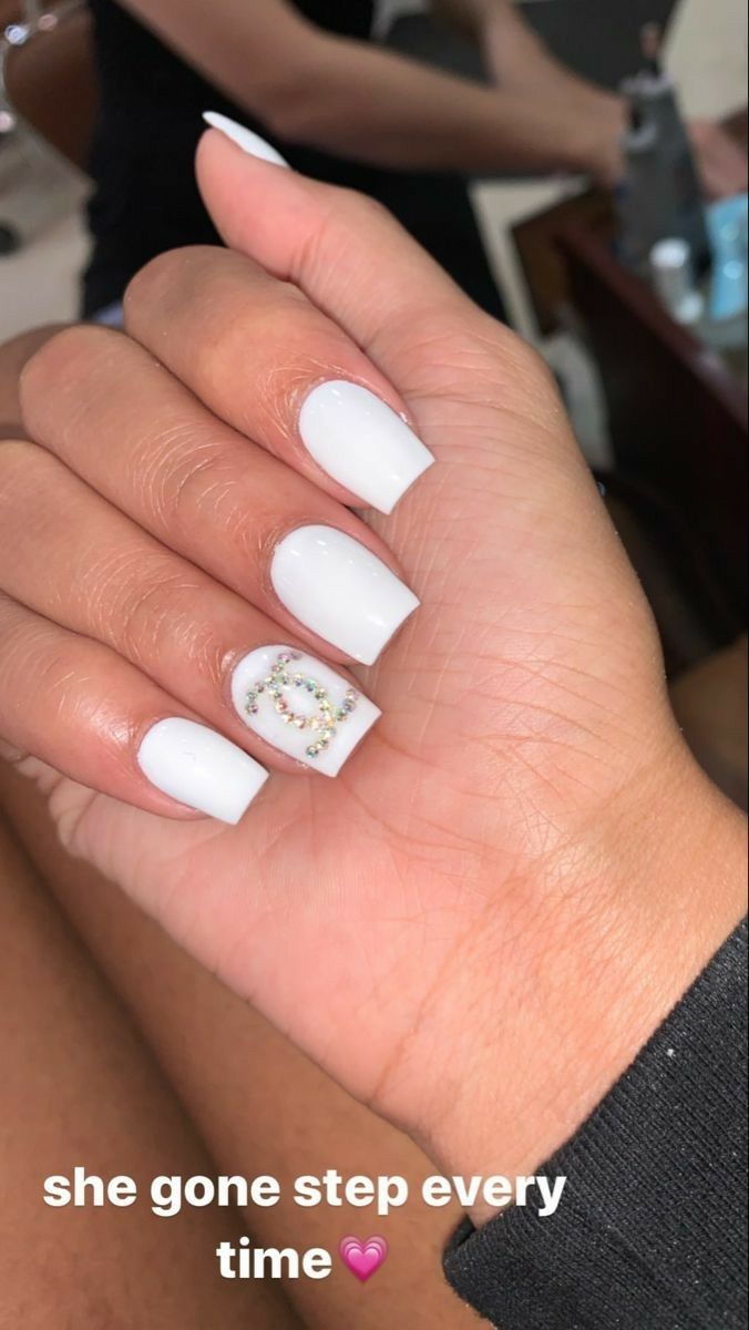 Sophisticated White Square Manicure with Adorned Letter Accent.