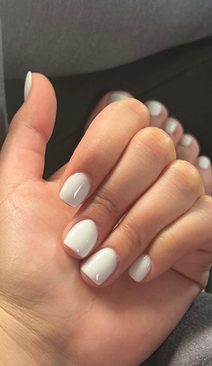 Elegant Minimalist White Nail Design: Versatile, Glossy Finish for Any Occasion.