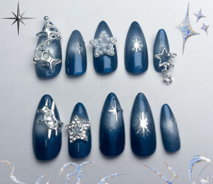 Celestial-Inspired Nail Design with Deep Blue Palette and Shimmering Accents