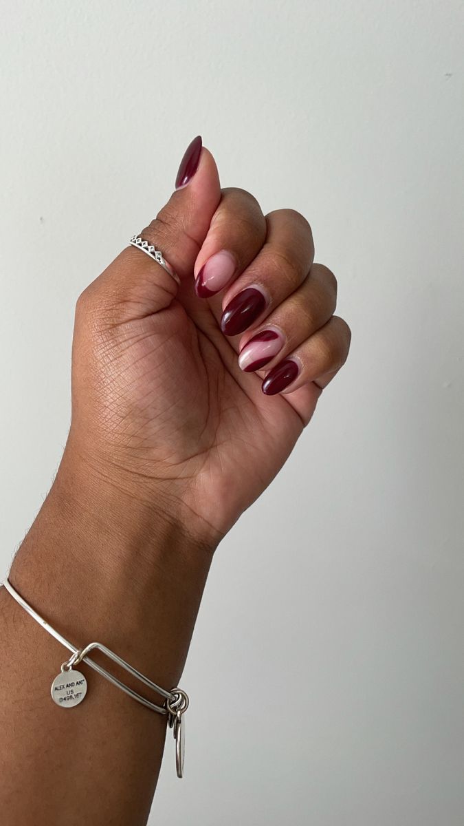 Sophisticated Almond-Shaped Nail Design with Burgundy and Nude Gradient.