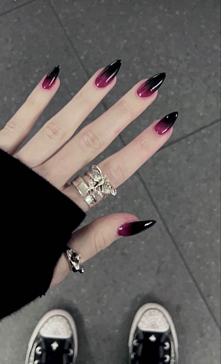 Bold Ombre Nail Design in Deep Red and Black with Edgy Shapes and Trendy Accessories.