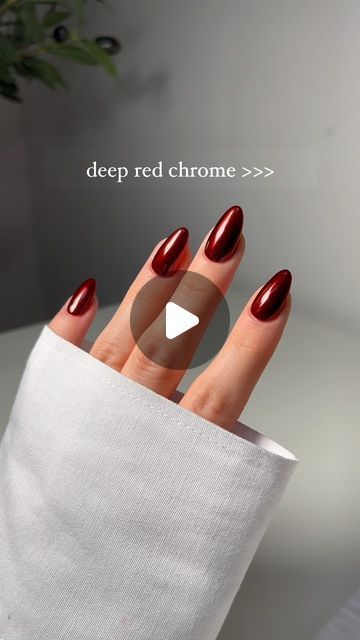 Striking Deep Red Chrome Almond Nails: Elegance Meets Bold Sophistication.