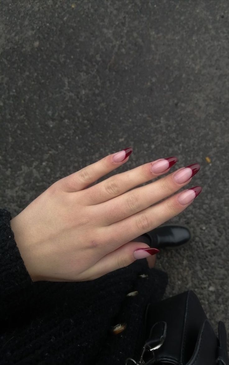 Sophisticated Gradient Nail Design with Soft Nude Base and Deep Burgundy Tips.