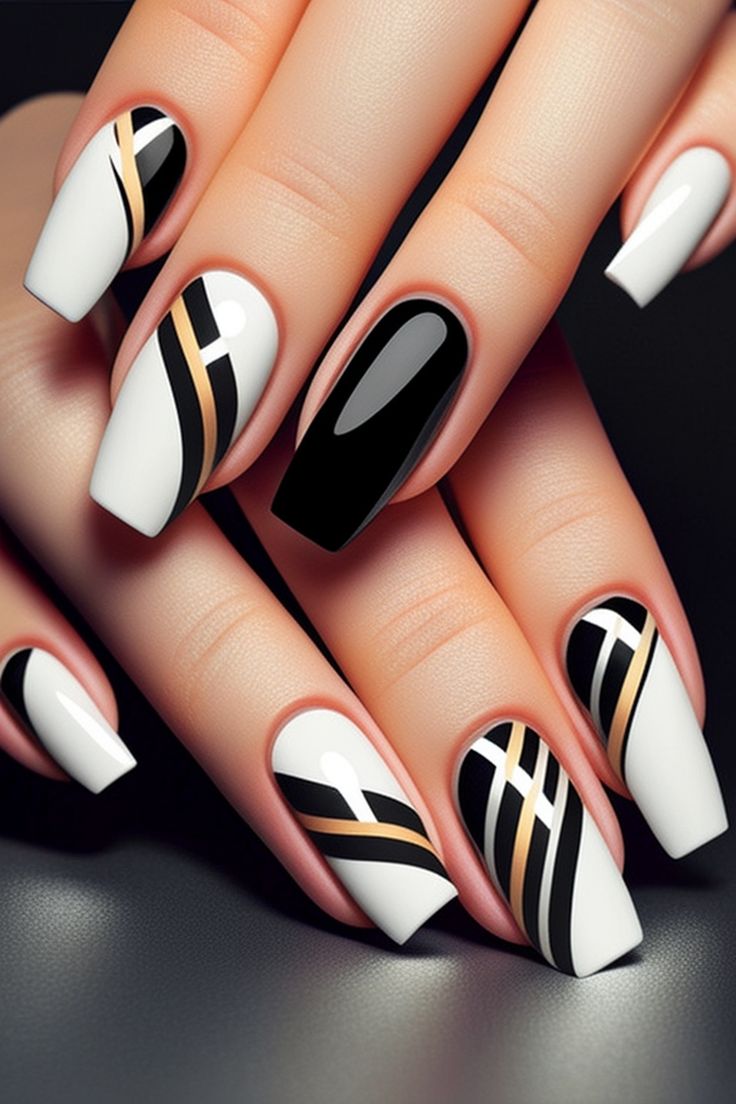 Chic Geometric Nail Design: Striking Black, White, and Gold Aesthetics with Glossy-Matte Contrast.